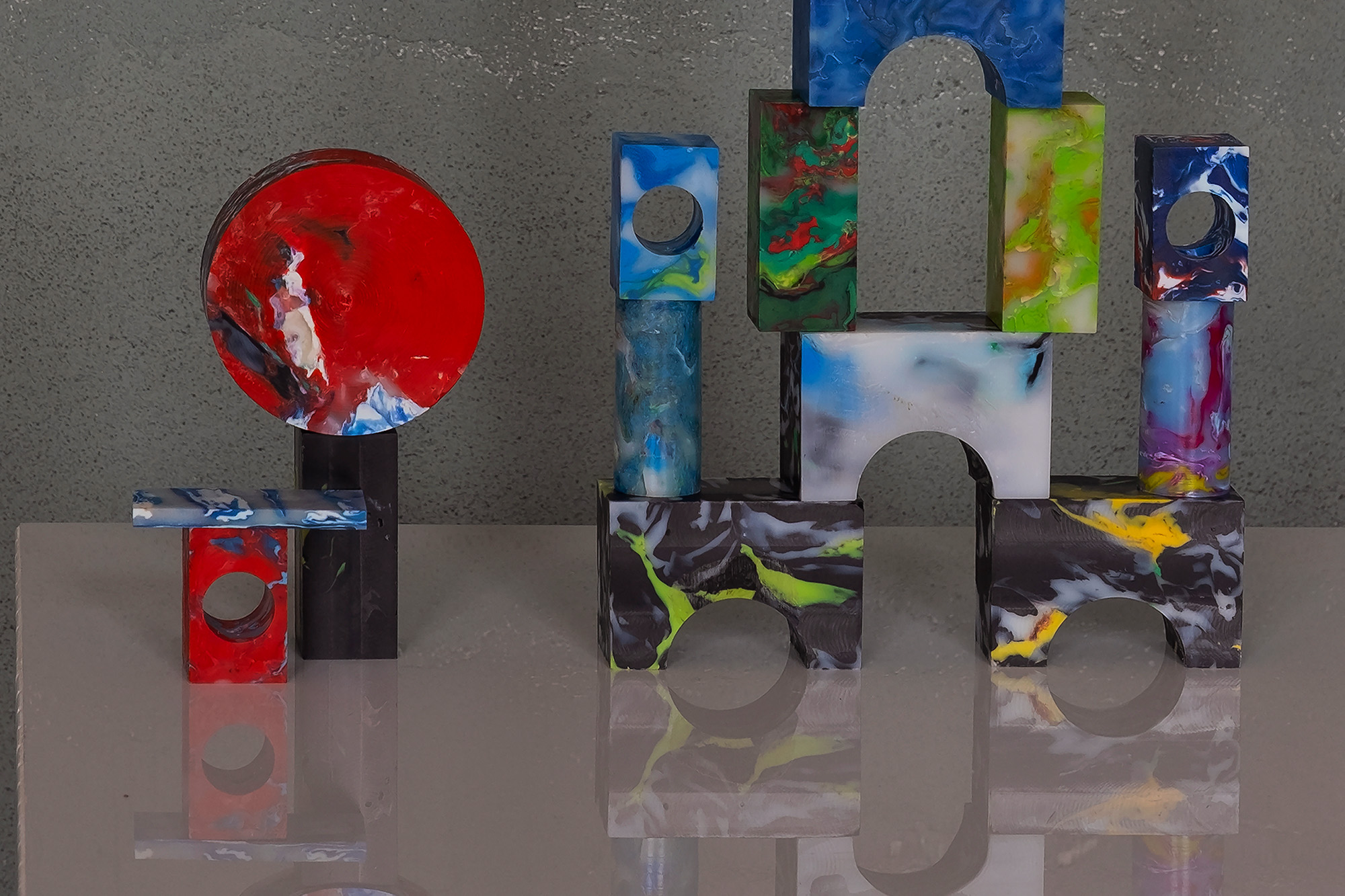 A structure made of blocks crafted from plastic and a foil calendar.