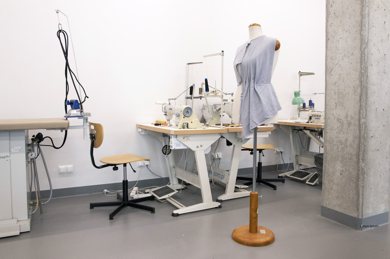 Interior of a sewing studio - tailor mannequin and sewing machine