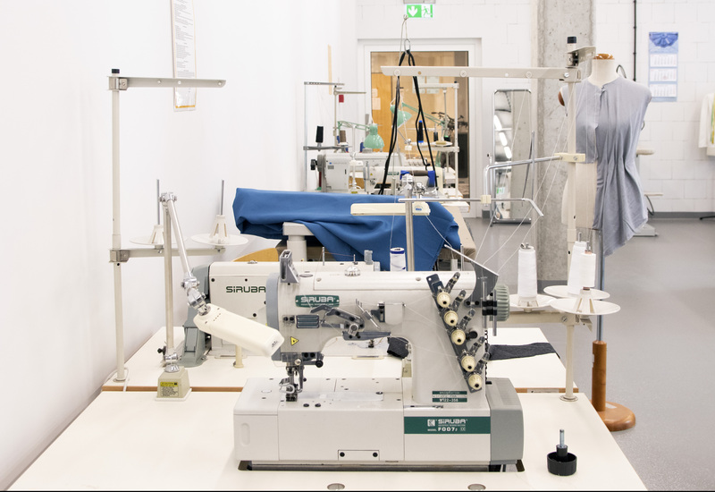 Workstation in the sewing workshop - view of sewing machine and sewing mannequin