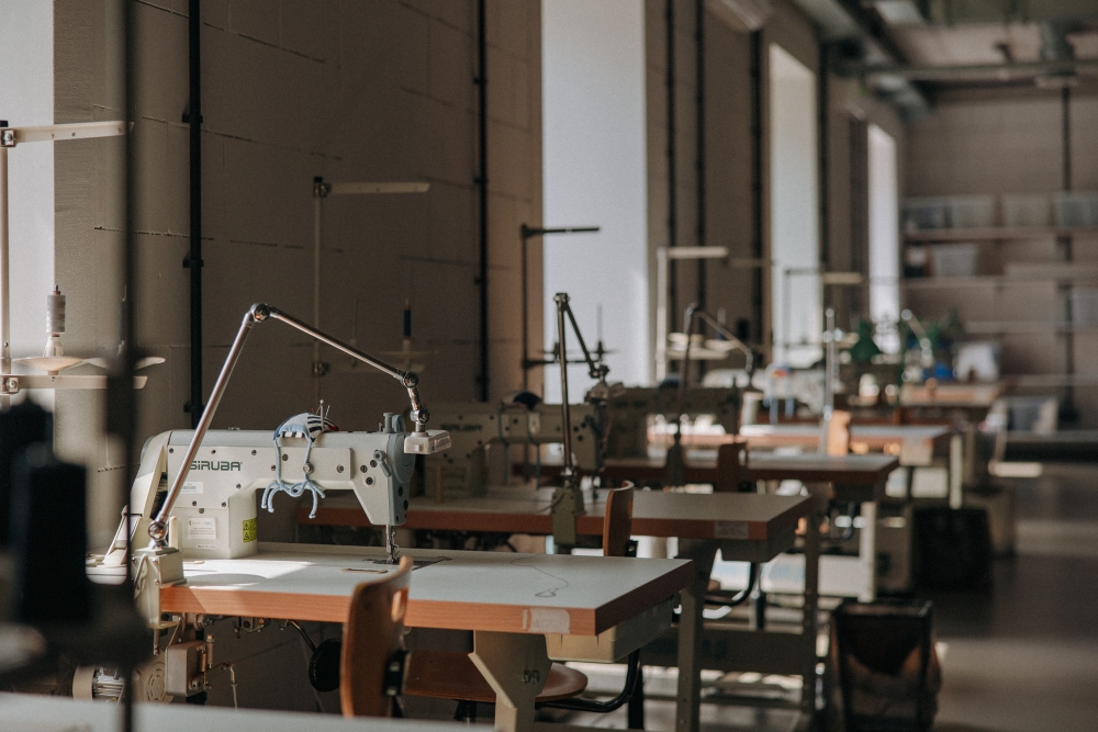 Interior of the Sewing Workshop with a row of sewing machines.