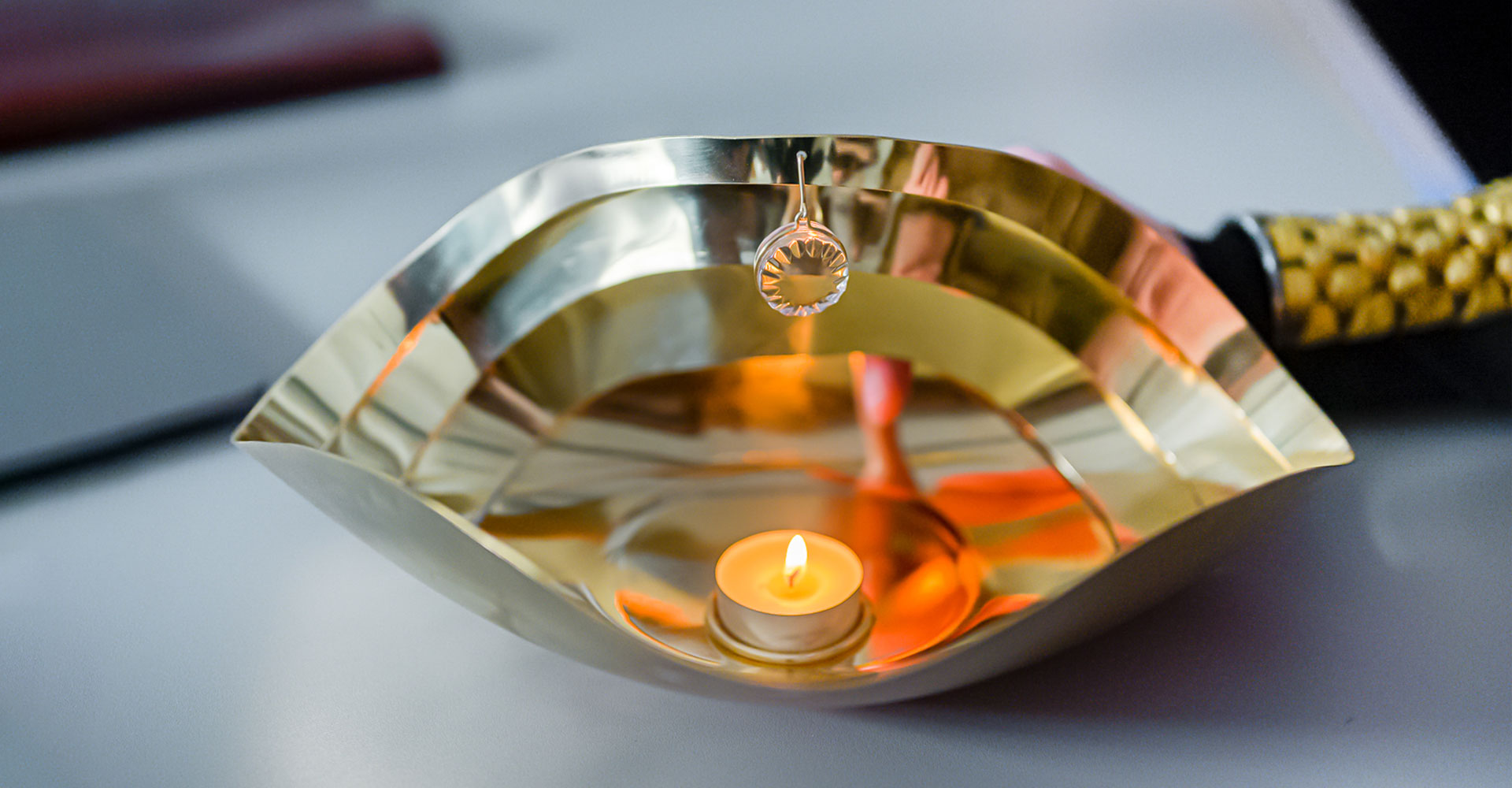Metal Ritual Bowl with a candle inside.