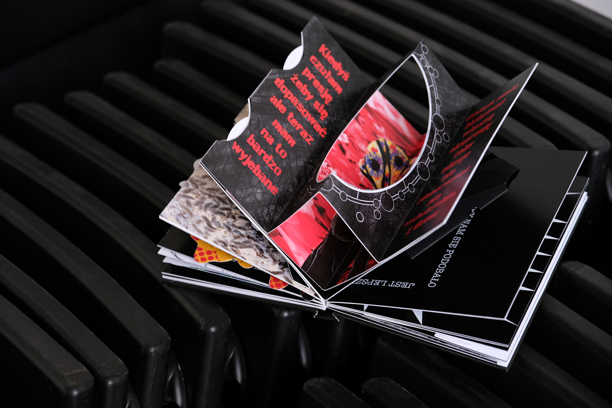 Open book with colorful illustrations inside, including 3D illustrations