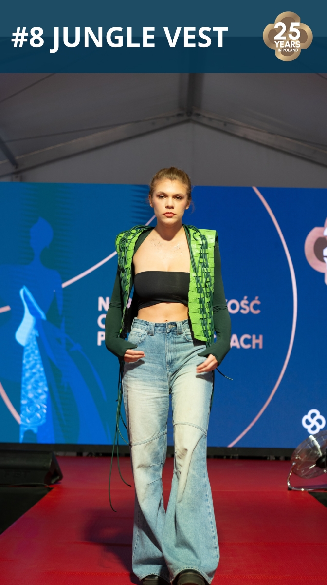 Fashion show: model wearing a vest made of roofing membrane.